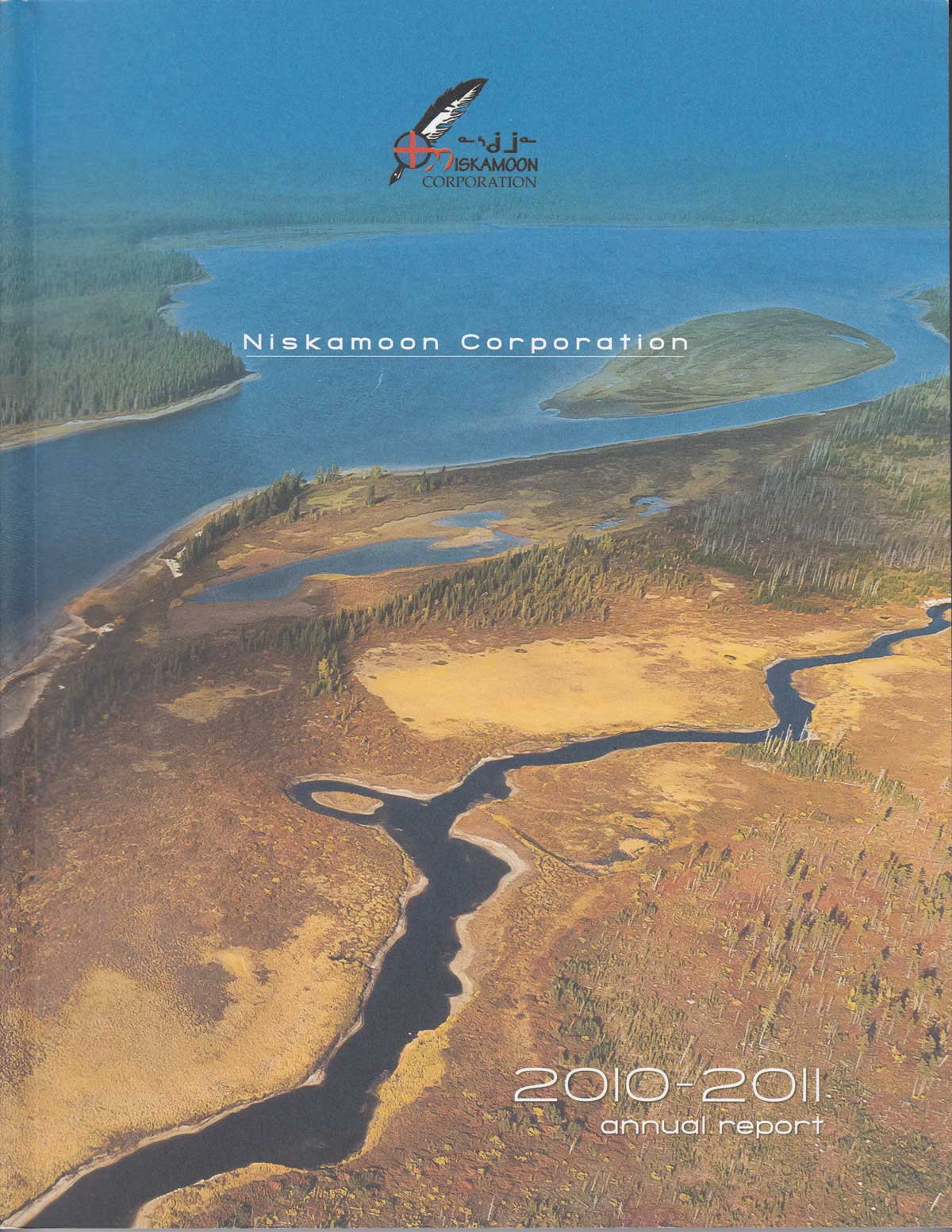 Aerial view of rivers, forests, and wetlands with “Nisakmoon Corporation” and “2010-2011 Annual Report” on the cover. The Nisakmoon Corporation logo featuring an eagle appears at the top.
