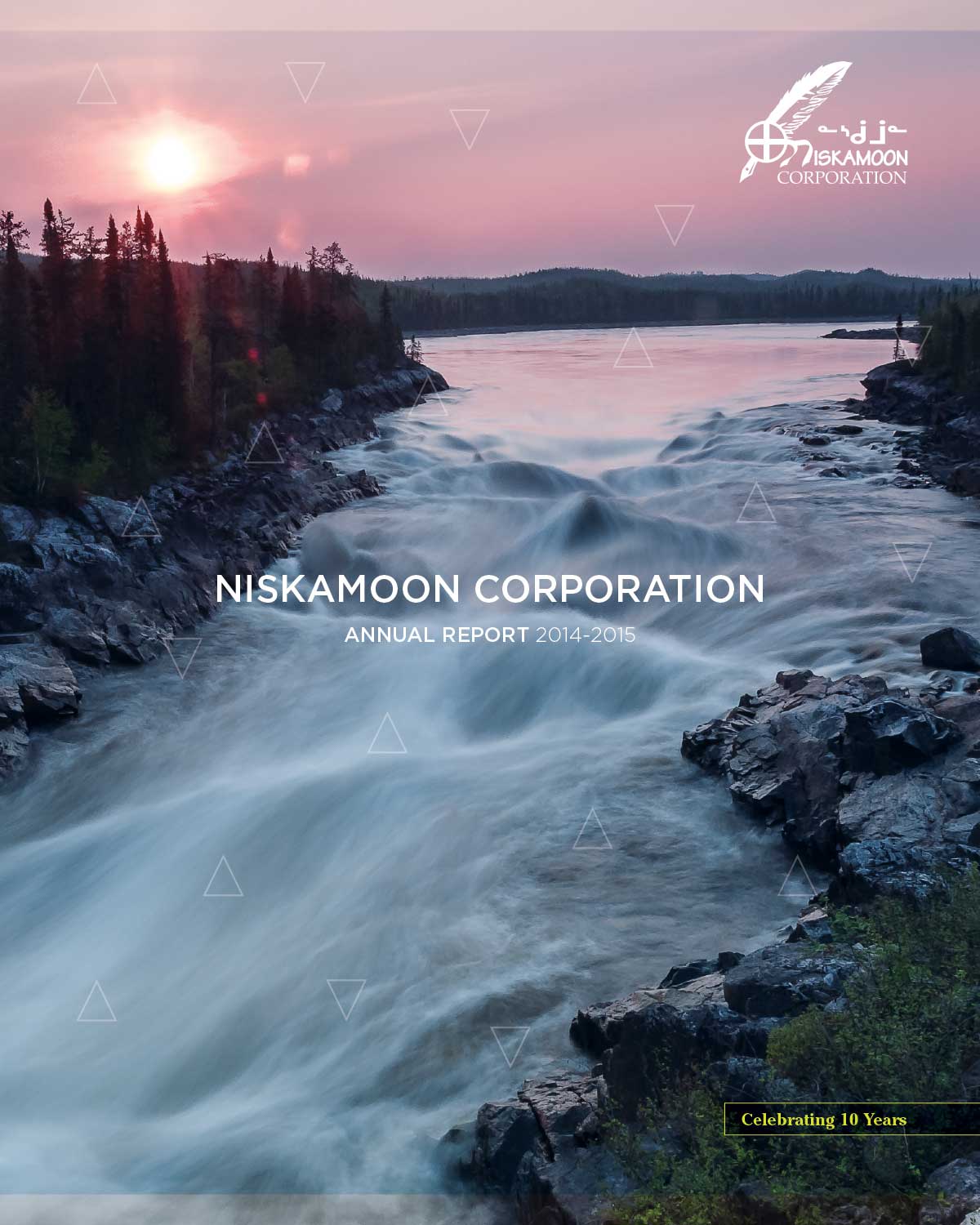 A river flows through rocky terrain at sunset with a forest in the background. Text reads "Niskamoon Corporation Annual Report 2014-2015." A logo is in the top right, and a banner below marks "Celebrating 10 Years: 2014-2015 Annual Report.